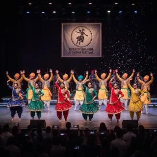Bhangra and Giddha dancers performing on stage at Dynasty Arts Organization festival